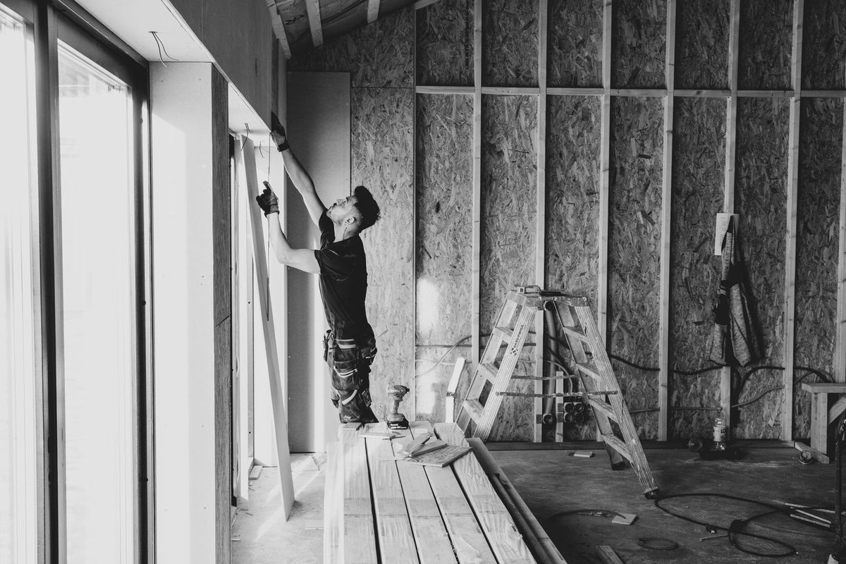 Room with exposed wall framing during renovation
