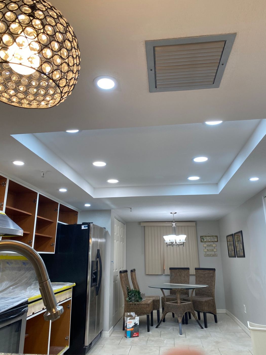 Kitchen with tray ceiling and recessed lights
