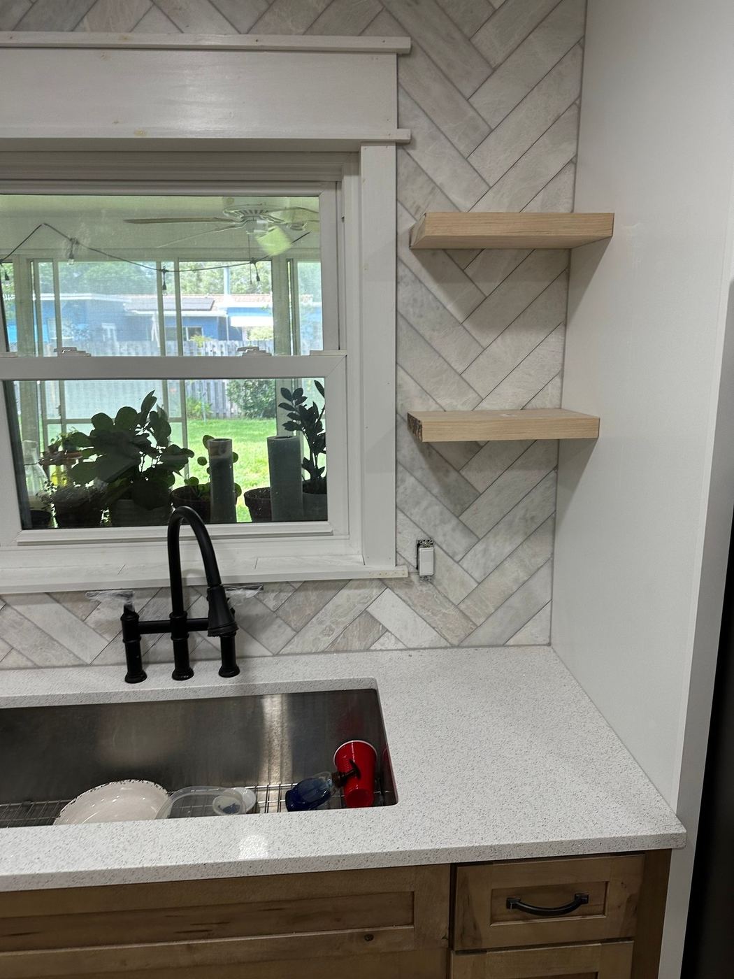 Kitchen sink wall: Farmhouse sink and floating shelves